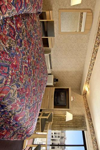 an overhead view of a room with a painting on the wall at Super 8 by Wyndham Atlantic City in Atlantic City