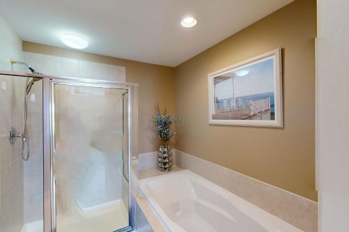 a bathroom with a shower and a bath tub at Bayville Shores --- 38331 Ocean Vista Dr #1162 in Selbyville