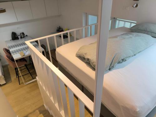 a bedroom with a bunk bed and a desk at Love 2 Solkan in Nova Gorica
