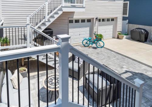 a bike sitting on a porch next to a house at Seaside Serenity 3-Bedroom Shore home 2 blocks to the beach and boardwalk in Seaside Heights