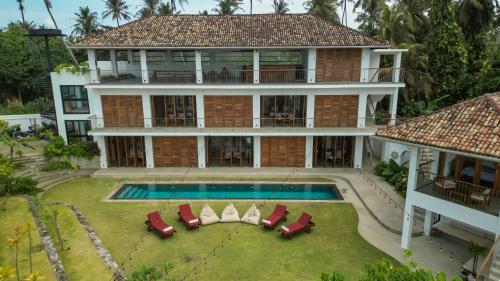 an aerial view of a house with a swimming pool at Marshmallow Bay Boutique Hotel & Surf Point Adults Only in Ahangama