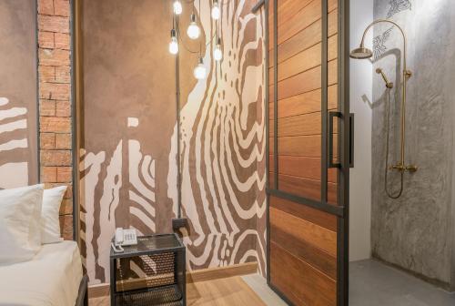 a bedroom with a sliding door and a bed at Sea Crest by Jomtien in Jomtien Beach