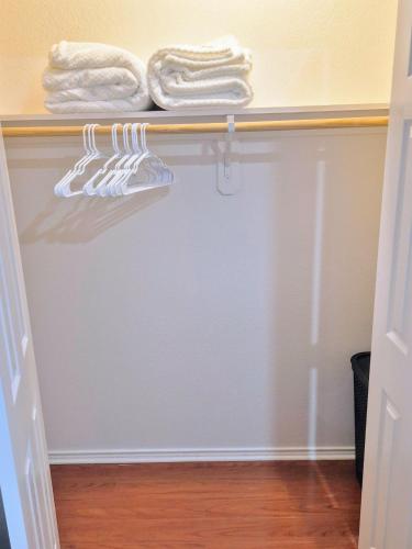 a closet with white towels on a shelf at Arlington Social in Arlington