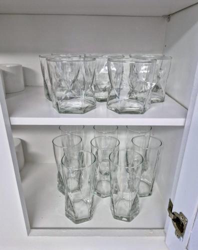 a group of glasses on a shelf in a refrigerator at Arlington Social in Arlington