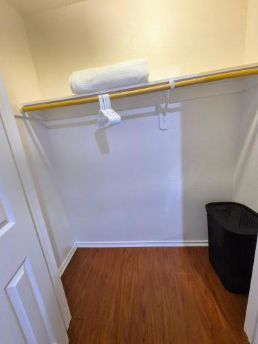 a room with a closet with a towel on a shelf at Arlington Social in Arlington