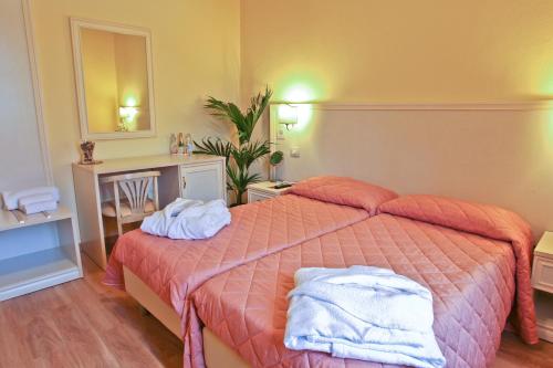 Postel nebo postele na pokoji v ubytování Hotel Il Monte