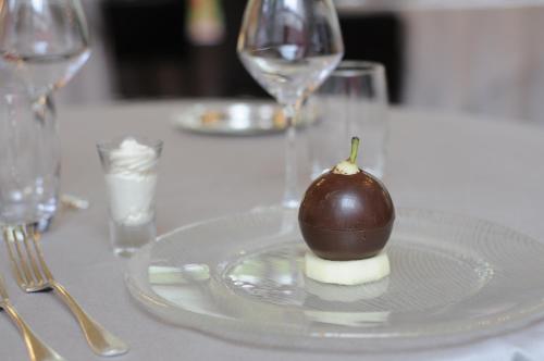 a chocolate dessert on a plate on a table at Demeures & Châteaux La Belle Meuniere in Royat