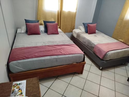 Postel nebo postele na pokoji v ubytování Hotel Los Rivera