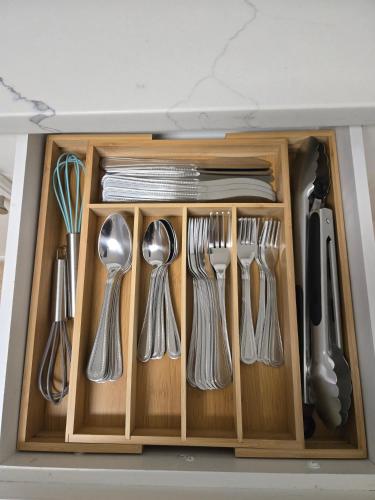a drawer filled with silver utensils in a kitchen at Arlington Social in Arlington
