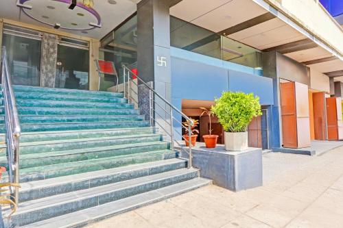 a set of stairs in front of a building at Collection O Kurnool Formerly Sai Priyanka Inn in Kurnool