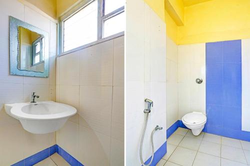 a bathroom with a sink and a toilet at Collection O Kurnool Formerly Sai Priyanka Inn in Kurnool