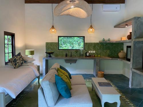 a living room with a couch and a table at Darmada Eco Resort in Sidemen