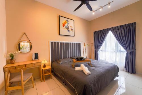 a bedroom with a bed and a desk and a window at Horizon Ipoh 8Pax 3R2B - Tropical Bird's Retreat in Ipoh