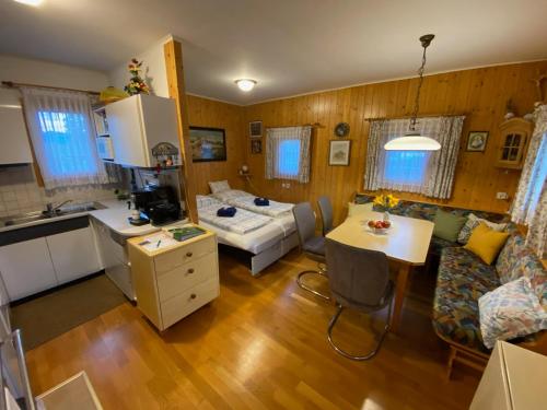 a kitchen and a living room with a kitchen and a living room at Troadkastn Familie Fritz in Passail