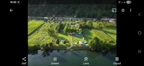 an aerial view of an island in the water at Kamp kućica trokrevetna in Crnča
