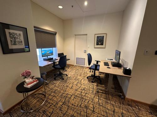 an office with two desks and chairs and two computers at Residence on Langley Park in Perth