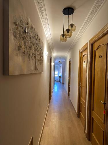 a corridor of a hallway with at Hostal Monica in Cilleruelo de Bezana