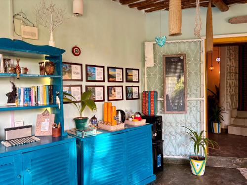 a room with a blue cabinet with books on it at Casa Hera Diani in Diani Beach