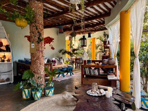 a living room with a table in the middle of it at Casa Hera Diani in Diani Beach