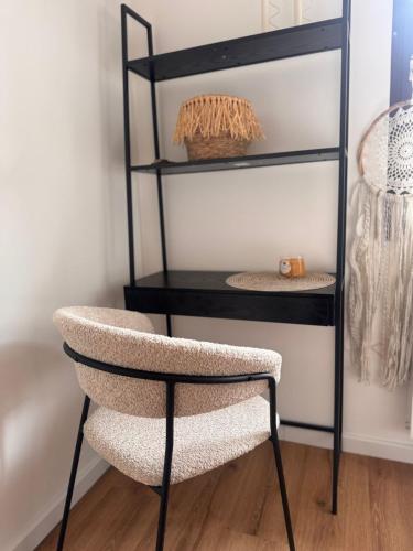 a chair in a room with a shelf at theroof in Bremm