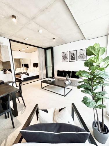a living room with a couch and a table at Black Diamond by ParberyProperty in Kingston 