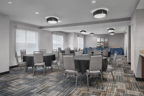 a conference room with a long table and chairs at Homewood Suites by Hilton Newark-Cranford in Cranford
