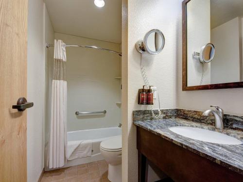 a bathroom with a sink and a toilet at The Golden Hotel, an Ascend Collection Hotel in Golden