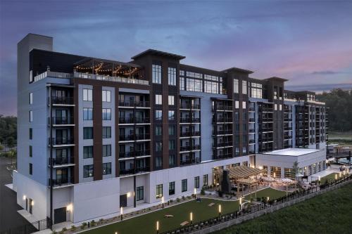 an architectural rendering of a large building with a courtyard at Embassy Suites By Hilton Pigeon Forge Resort in Pigeon Forge