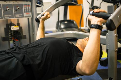 a man is in a gym performing a workout at Kempinski Hotel Khan Palace in Ulaanbaatar