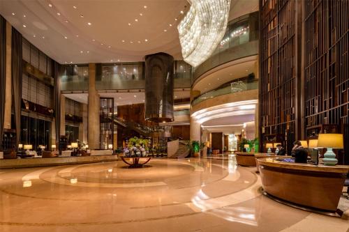 a lobby of a building with a large building at Kempinski Hotel Xiamen in Xiamen