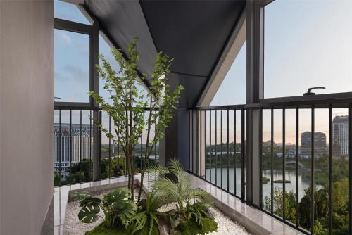 a view from the balcony of a building with plants at Hilton Garden Inn Guiyang Gui'An New Area in Guiyang