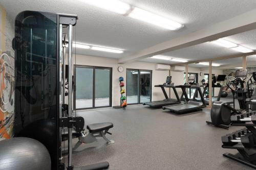 a gym with treadmills and machines in a room at Hawthorn Extended Stay by Wyndham Ft Lauderdale Cypress Crk in Fort Lauderdale
