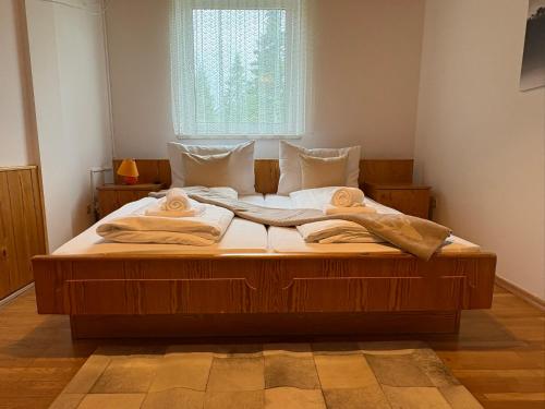 a bedroom with a large bed with towels on it at Edelweiss Lodge Lachtal I Self Check-in in Lachtal