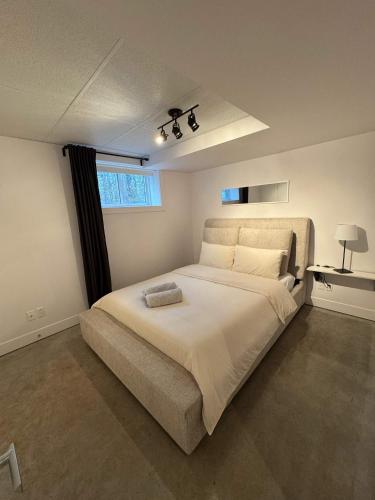 a bedroom with a large bed and a window at Spa River and Comfort - Domaine de la Seigneurie in Sainte Béatrix