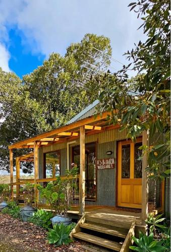 a small house with a porch and a deck at Accessible, Inclusive studio, Barossa Valley SA - It's Bonza at Mill About Vineyard in Williamstown