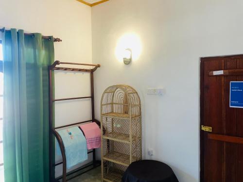Ένα ή περισσότερα κρεβάτια σε δωμάτιο στο Janaka's House