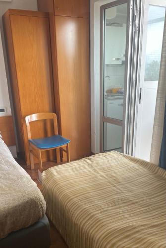 Ένα ή περισσότερα κρεβάτια σε δωμάτιο στο Casavacanze Internazionale