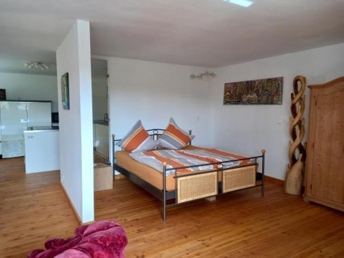a bedroom with a bed in a room at Pension Espenhof 