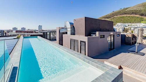 a swimming pool on the roof of a building at Designer apartment in Sea Point with rooftop pool in Cape Town