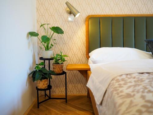 Ένα ή περισσότερα κρεβάτια σε δωμάτιο στο Hotel 16 & Apartments Prague City Living