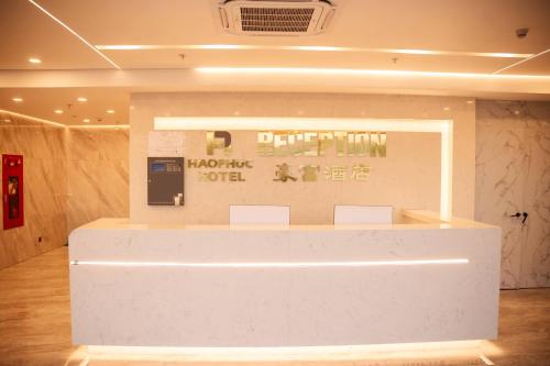 a lobby with a large white counter in a room at Hào Phúc Hotel 