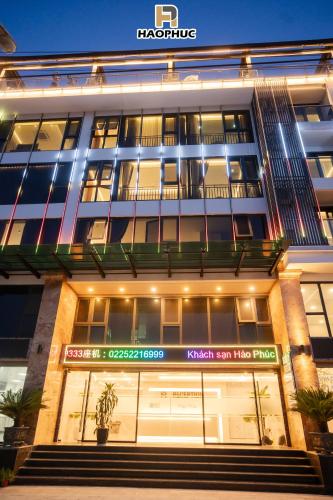 a large building with a sign on the front of it at Hào Phúc Hotel 