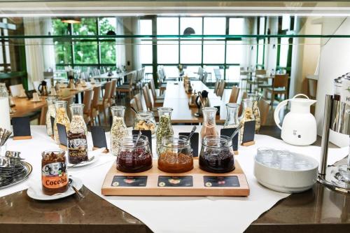a long table with jars of food on it at Haus Maria Lindenberg in Sankt Peter