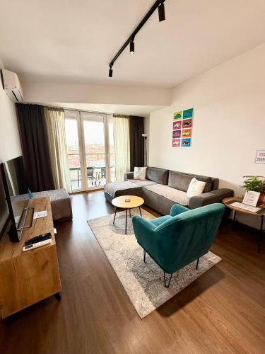 a living room with a couch and a table at MML Apartment Skopje in Skopje