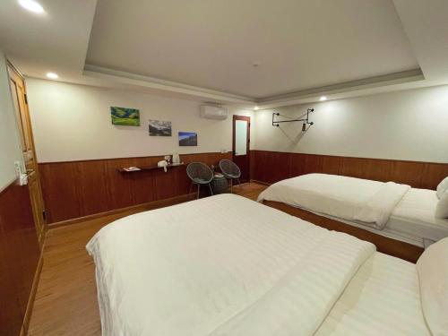 Postel nebo postele na pokoji v ubytování Flaco Hostel Sapa