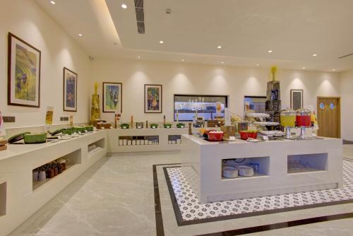 a store with a lot of food on display at Cygnett Inn in Dibrugarh