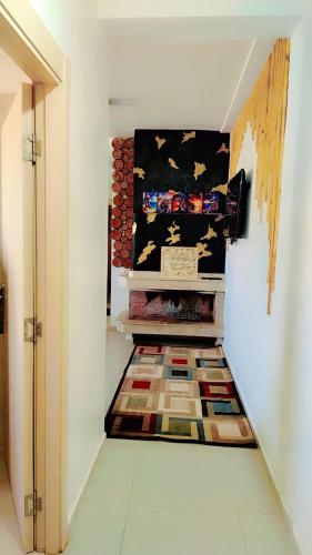 a hallway with a rug on the floor in a room at résidence calme in Ifrane