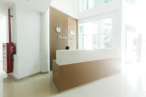a lobby with a reception desk in a building at Urbanview Hotel Syariah UIN Mataram in Mataram