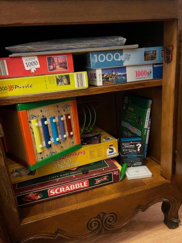 a book shelf filled with lots of books at Eifel Fewo in Neuerburg