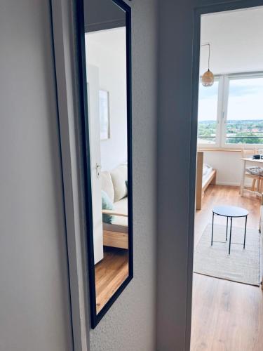 a mirror on a wall next to a room at Ferienwohnung Ostseetraum in Wendtorf